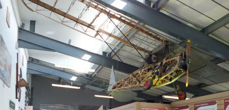 Photo of the plane designed and built by Jim Smith. The plane has been suspended from the roof of the museum.