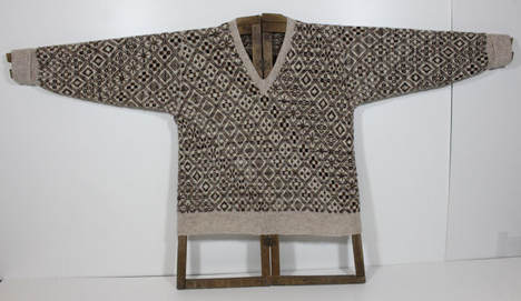 Photo of a fair isle all-over jumper on a jumper board