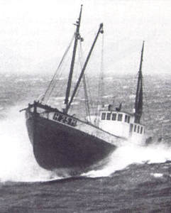 Old photo of one of the Shetland Bus fishing boats in rough weather