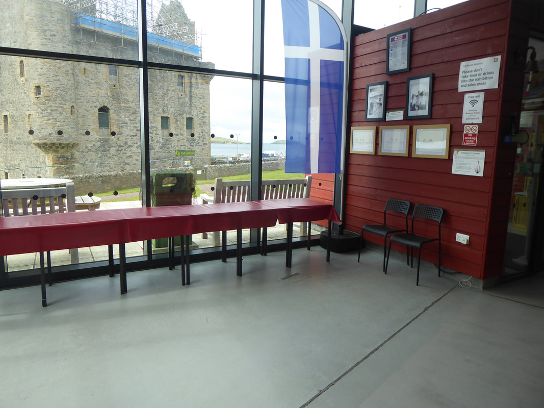 Photo of our cafe area with the view of the castle through the window